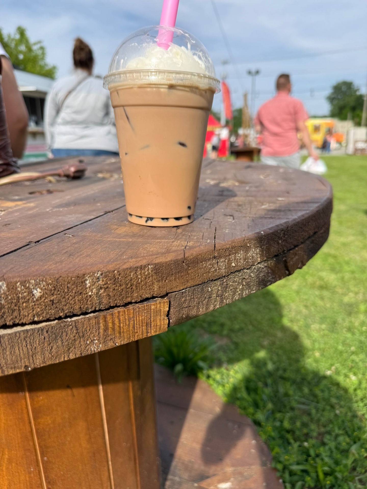 Iced bubble tea on a wooden spool table