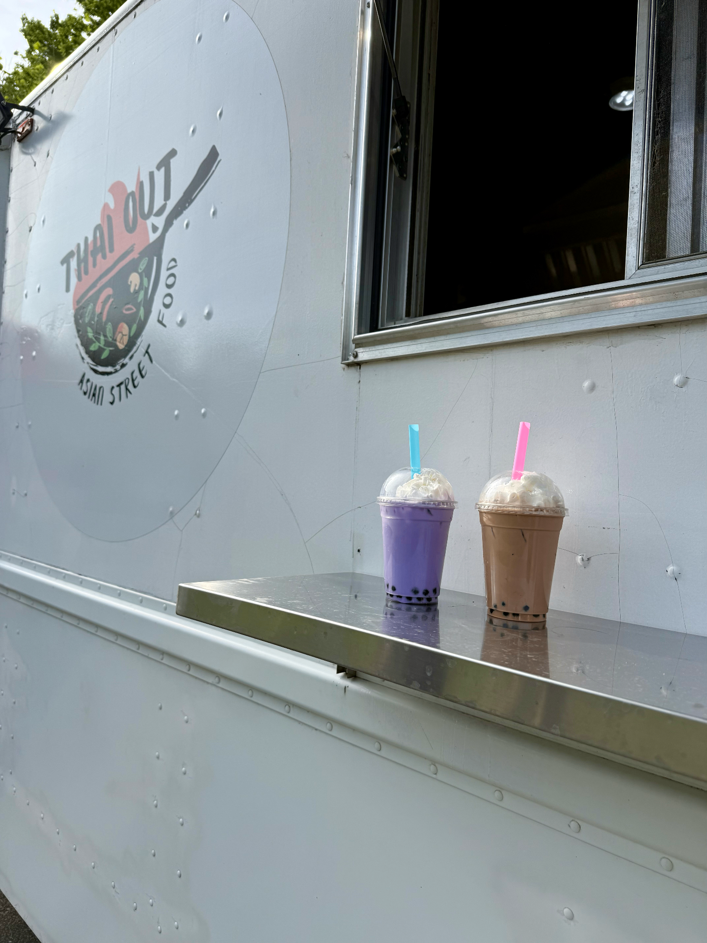 Two boba teas at the truck window
